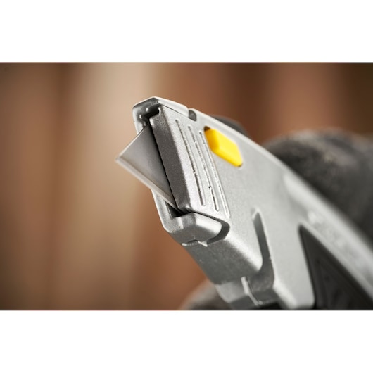 STANLEY 0-10-788 utility knife close-up showing metal blade and yellow button.