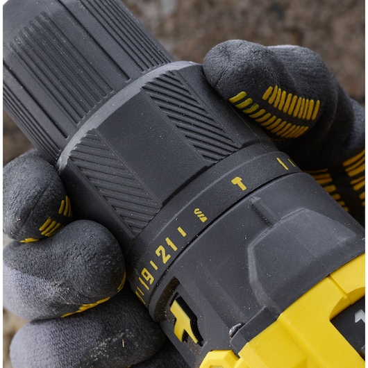 STANLEY SFMCD711B cordless drill close-up showing grip, torque settings, and yellow-black casing.